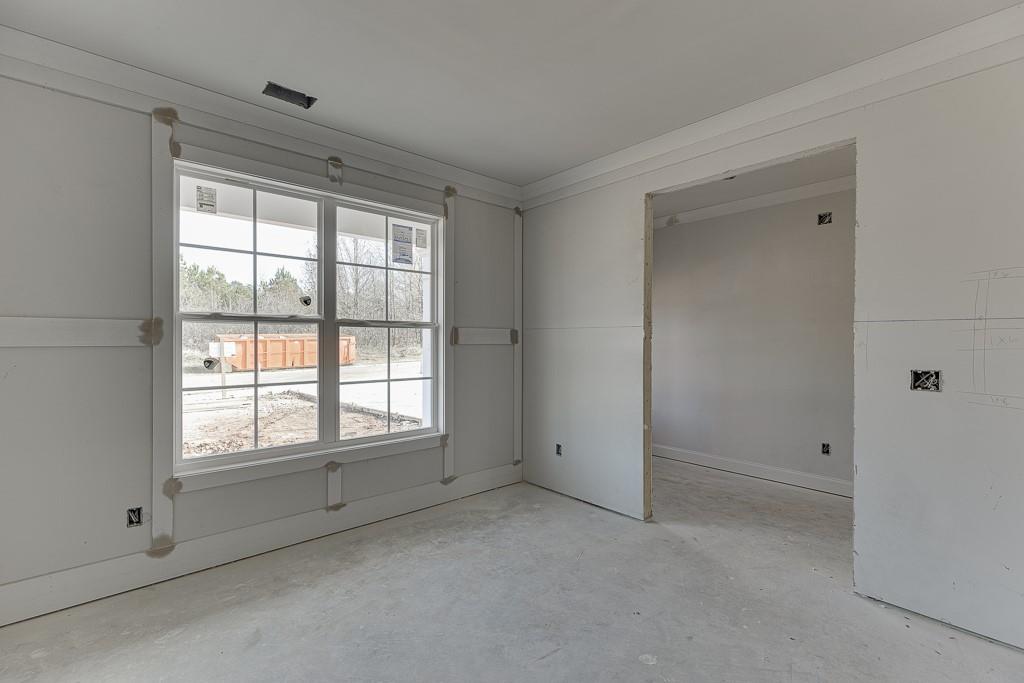 1075 Poppy Lane Jefferson, GA 30549 - Photo 6 of 36 a view of an empty room with a window