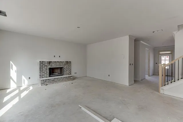 a view of empty room with fireplace