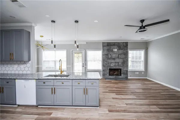 a view of walk in closet with wooden floor and cabinet