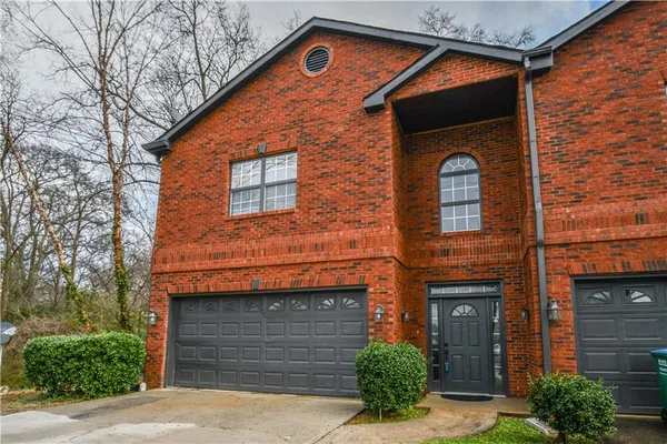 a front view of a house with garage