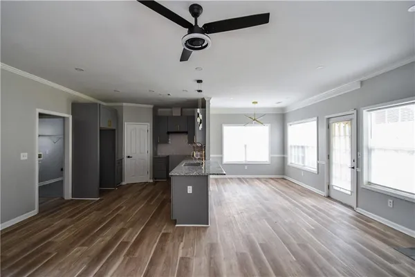 a living room with a fireplace and windows