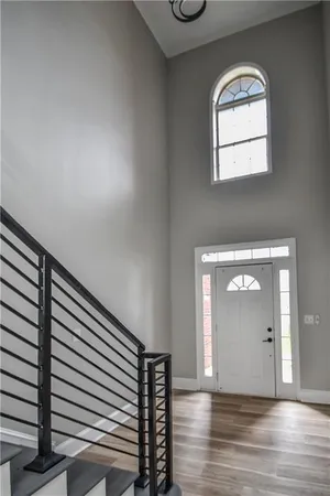 wooden floor in a hall with a window