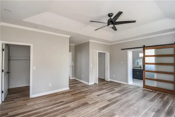 a bathroom with a granite countertop tub sink and mirror
