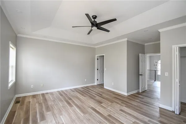 a bathroom with a shower and a sink