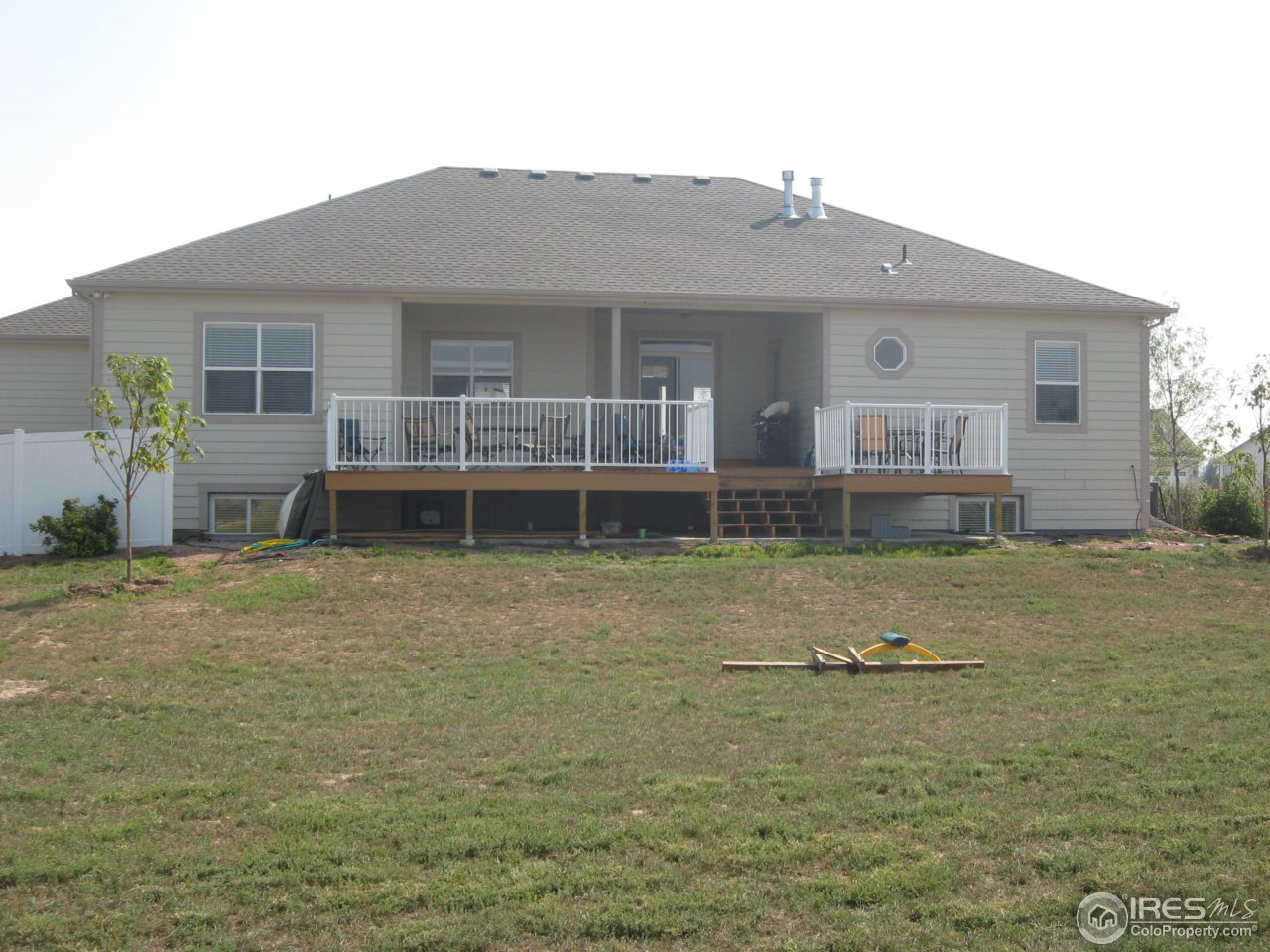 1303 Park Ridge Drive Severance, CO 80615 - Photo 10 of 10 a front view of a house with garden