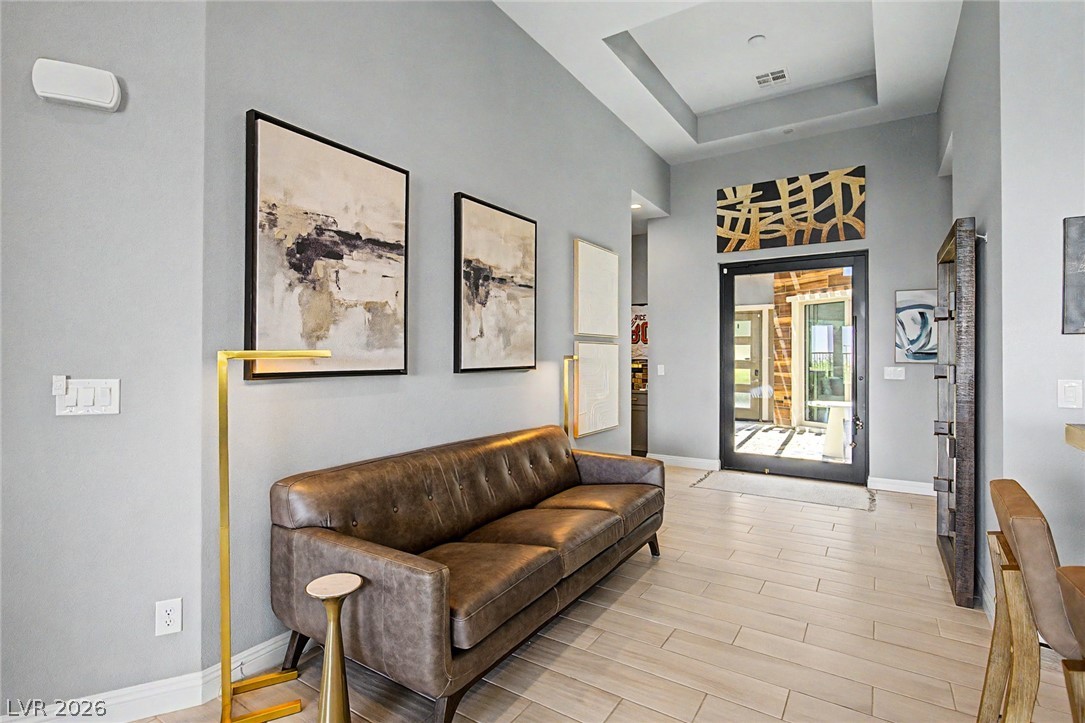 6014 Willow Ridge Court Las Vegas, NV 89135 - Photo 13 of 99 This inviting entryway features high ceilings and sleek flooring, creating an expansive first impression.