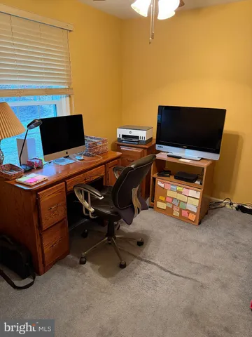 a view of a workspace with furniture