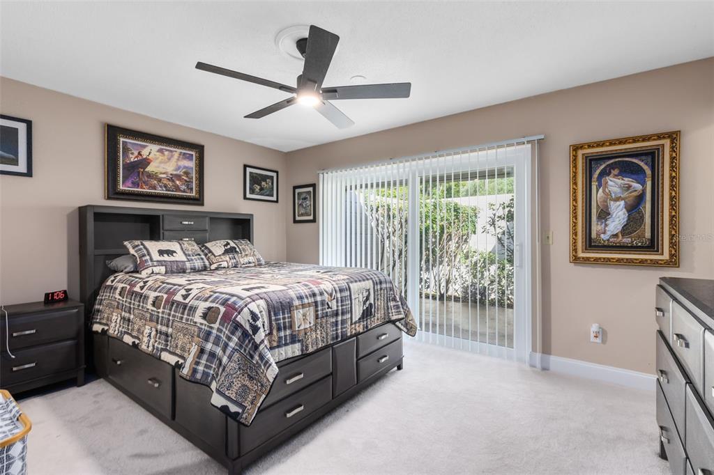 440 East Orange Street Altamonte Springs, FL 32701 - Photo 14 of 39 a bed sitting in a bedroom next to a window