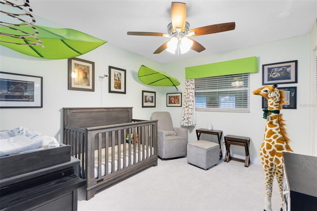 440 East Orange Street Altamonte Springs, FL 32701 - Photo 17 of 39 a bedroom with furniture and a chandelier