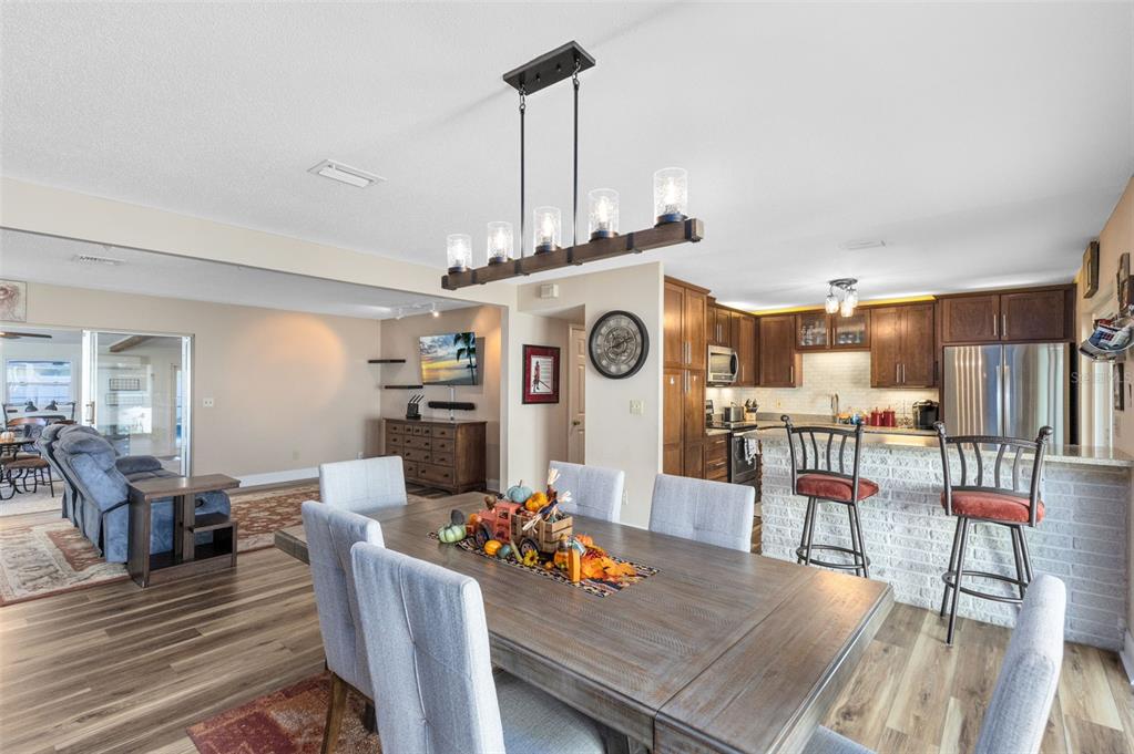 440 East Orange Street Altamonte Springs, FL 32701 - Photo 2 of 39 a view of a dining room with furniture a rug and wooden floor
