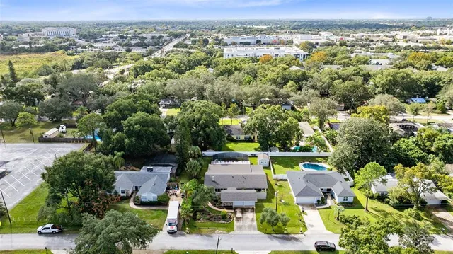 an aerial view of a house with a garden