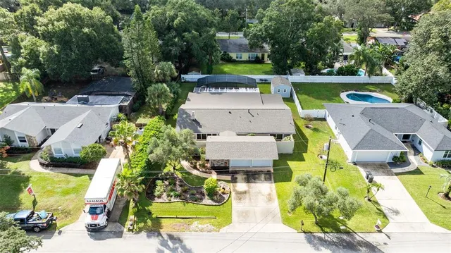 an aerial view of a house with a swimming pool