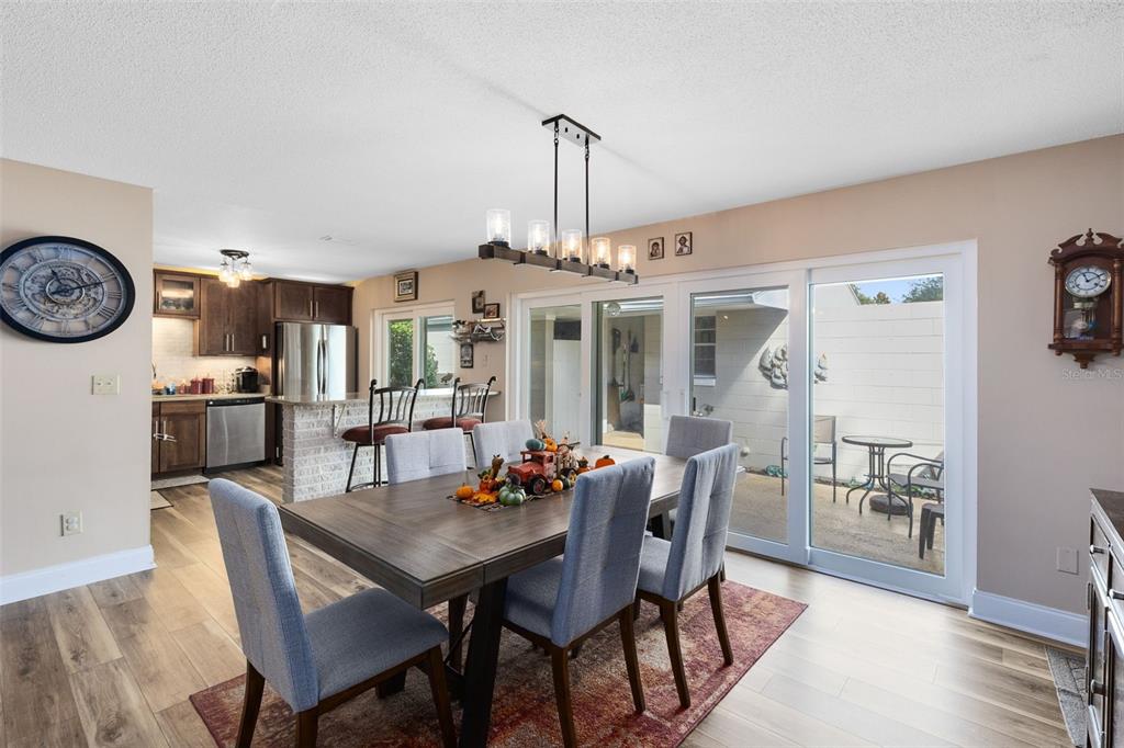440 East Orange Street Altamonte Springs, FL 32701 - Photo 4 of 39 a view of a dining room with furniture and wooden floor