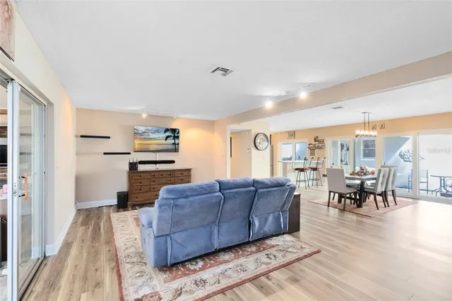 a living room with furniture and large windows