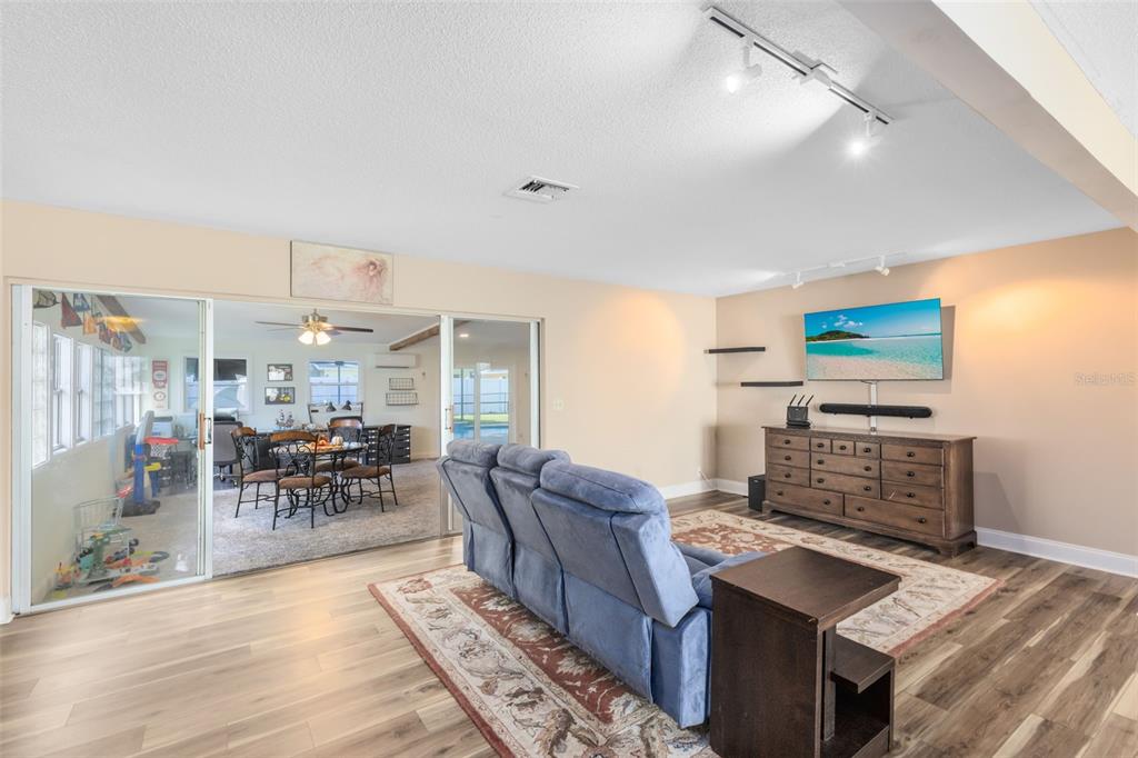 440 East Orange Street Altamonte Springs, FL 32701 - Photo 9 of 39 a living room with furniture wooden floor and a fireplace