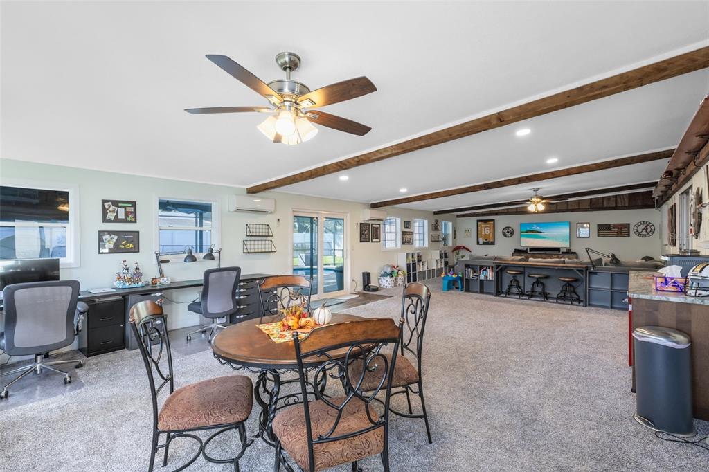 440 East Orange Street Altamonte Springs, FL 32701 - Photo 10 of 39 a view of a dining room with furniture window and wooden floor
