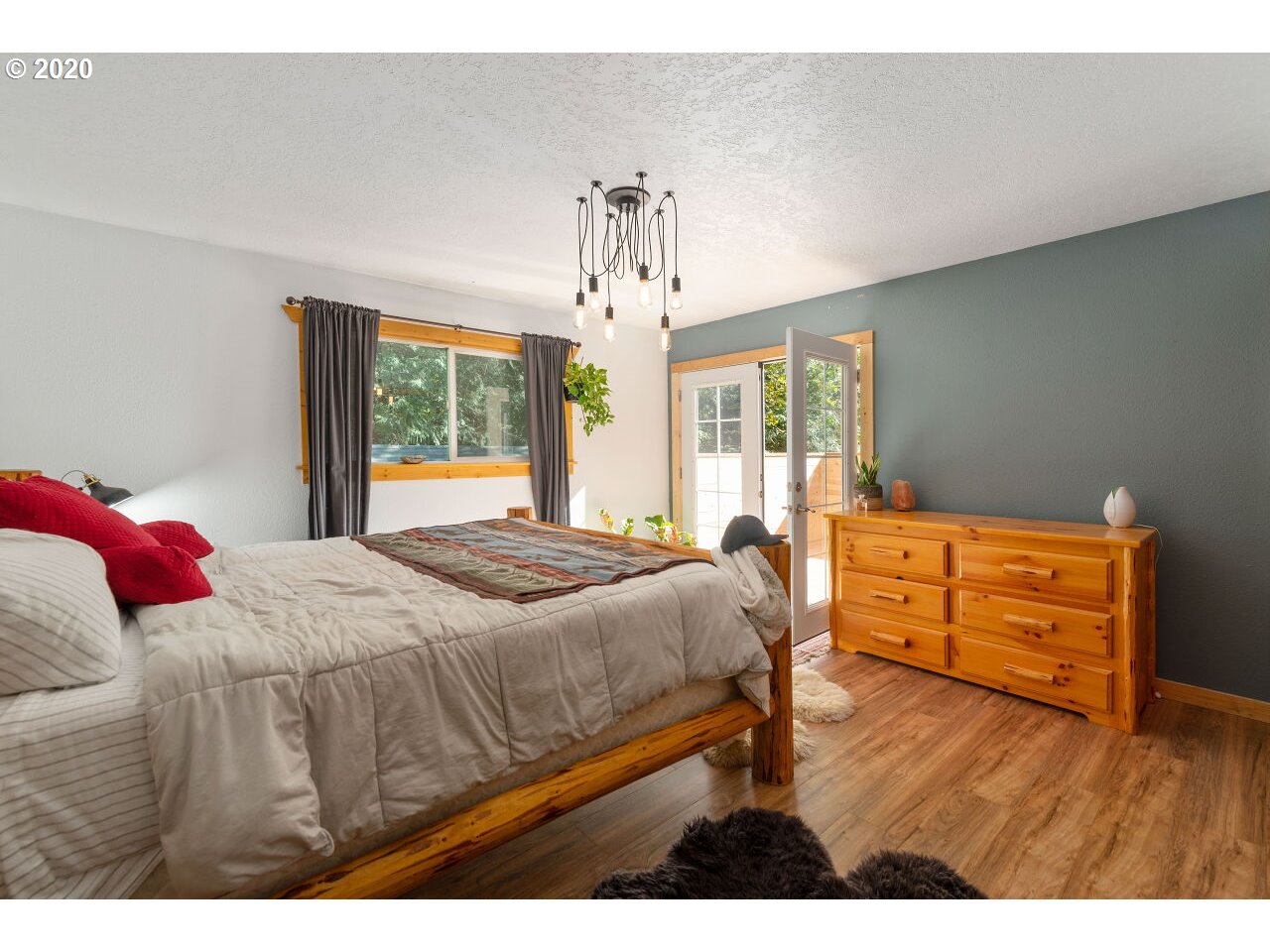 27780 East John Lake Road Rhododendron, OR 97049 - Photo 20 of 32 a bedroom with a bed and wooden floor