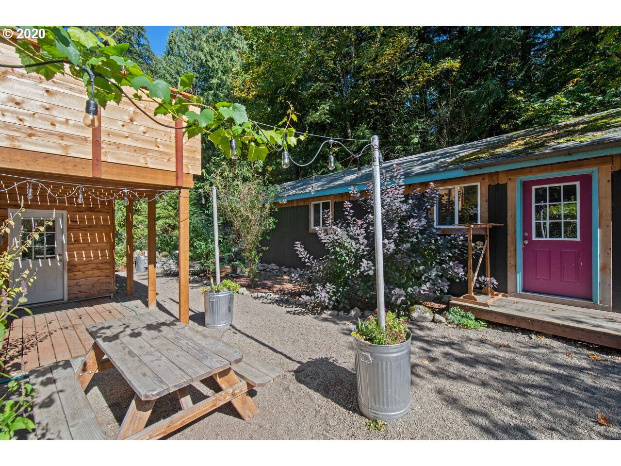27780 East John Lake Road Rhododendron, OR 97049 - Photo 28 of 32 a view of a patio with couches and potted plants