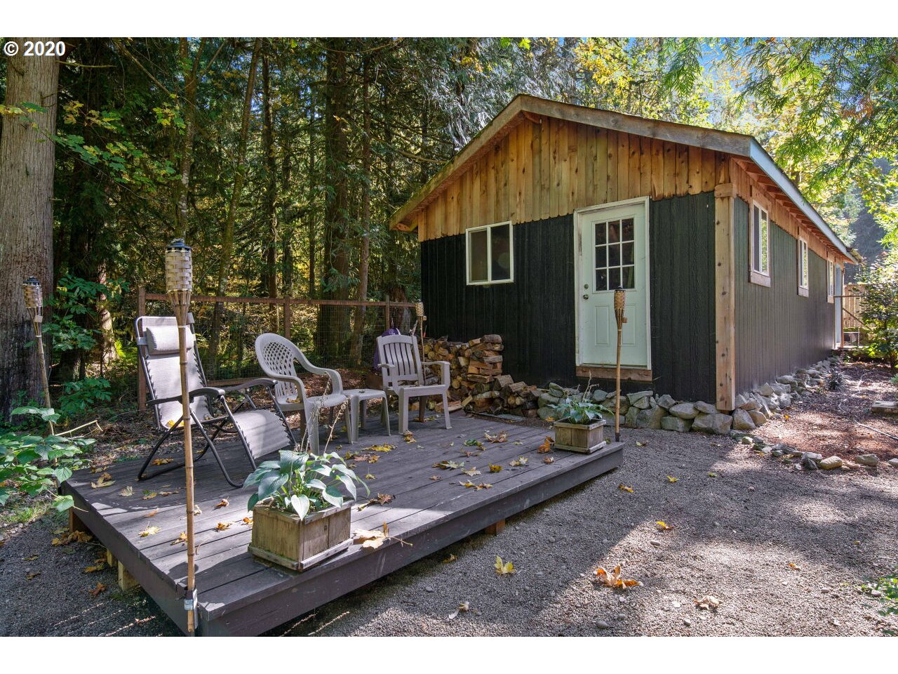 27780 East John Lake Road Rhododendron, OR 97049 - Photo 30 of 32 a backyard of a house with yard barbeque oven and outdoor seating