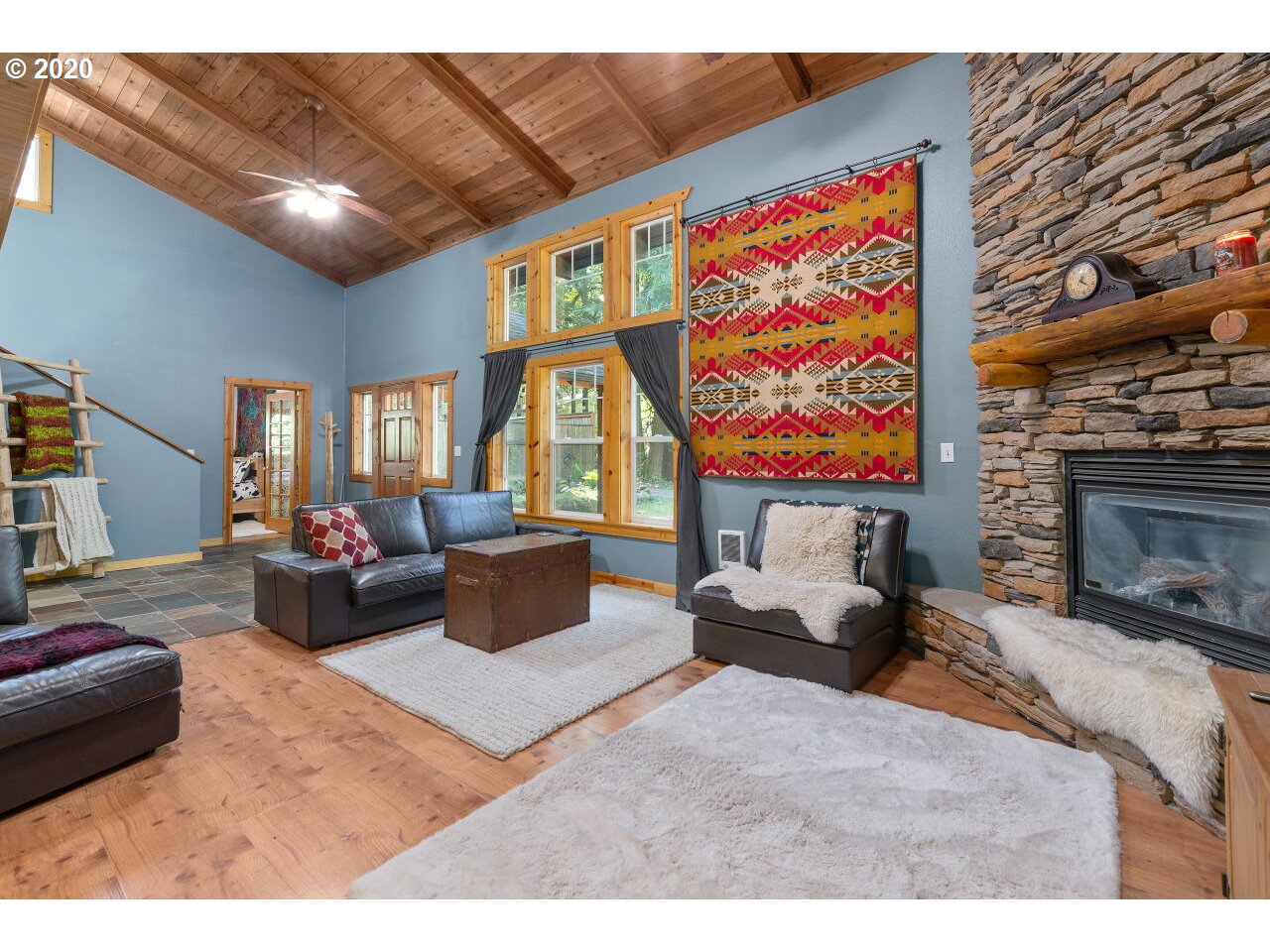 27780 East John Lake Road Rhododendron, OR 97049 - Photo 6 of 32 a living room with furniture and a fireplace