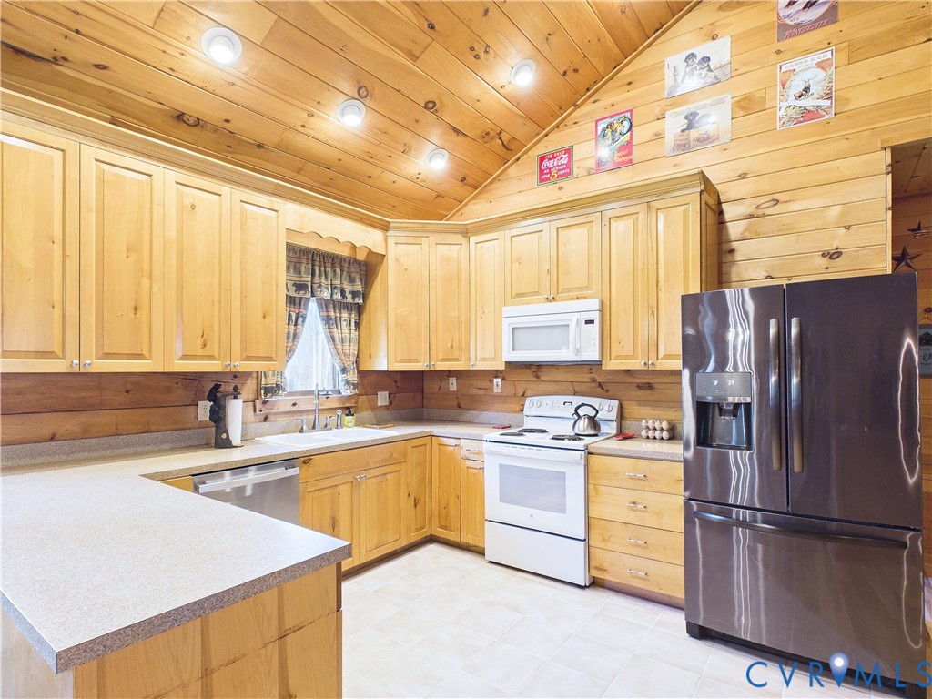 469 Jenkins Church Road Cumberland, VA 23040 - Photo 4 of 40 a kitchen with a sink a refrigerator and window