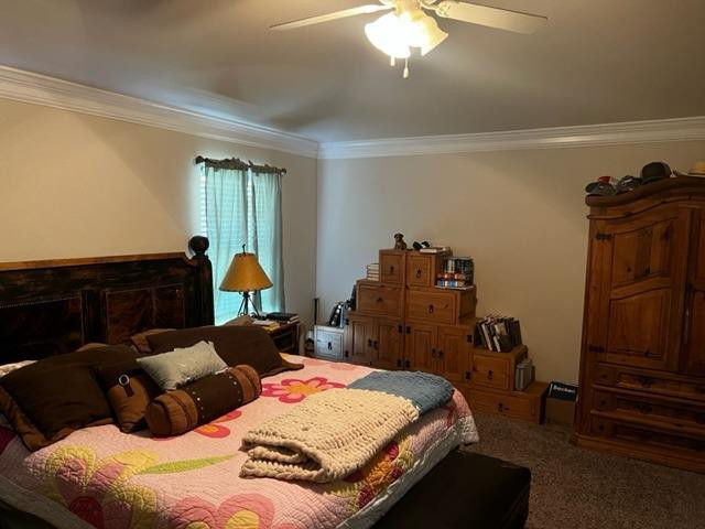 9104 Ridgely Avenue Lubbock, TX 79424 - Photo 13 of 19 a bedroom with a bed and dresser with mirror