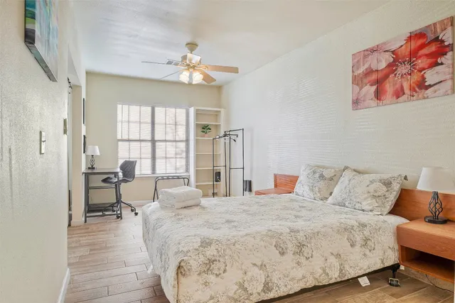 a bedroom with a bed and a couch