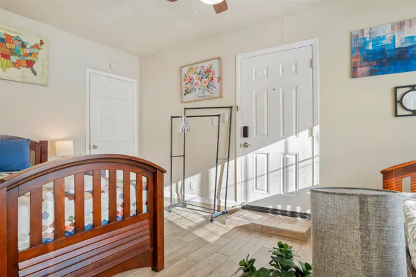 a bedroom with bed and a window