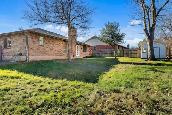 a backyard of a house with lots of green space