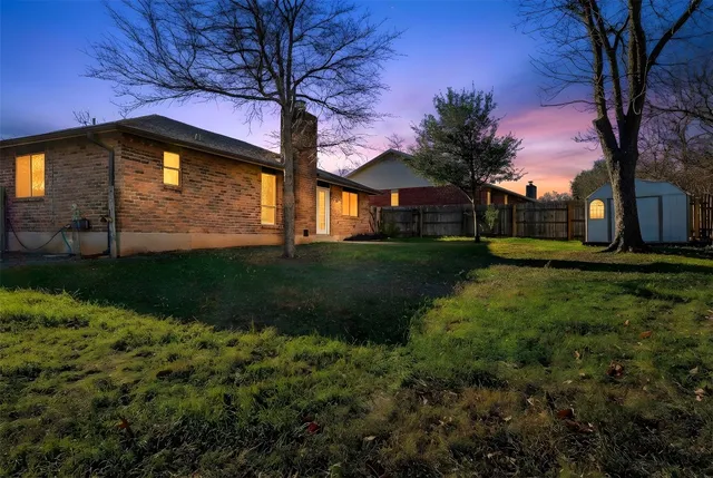 a house with huge green field in front of it