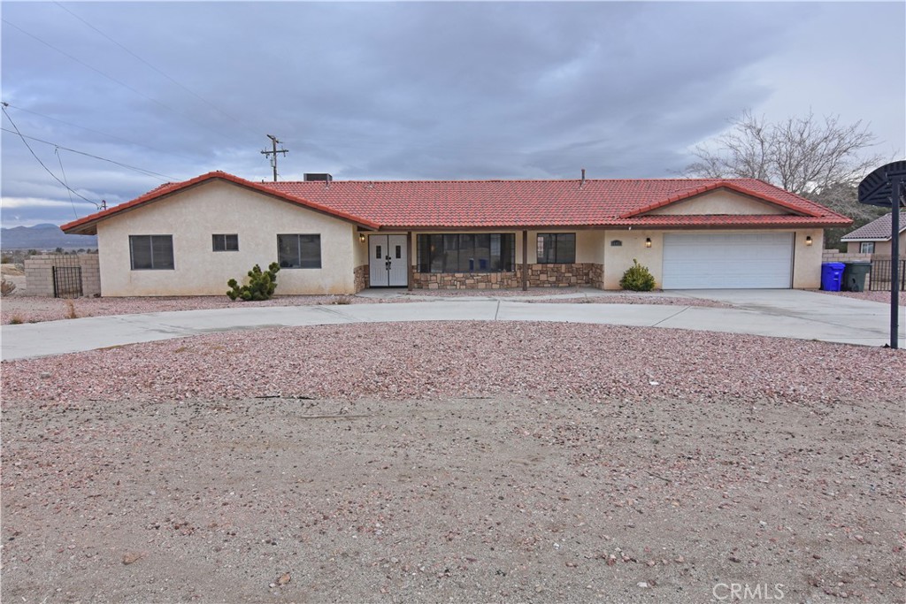 16427 Rancherias Road Apple Valley, CA 92307 - Photo 1 of 1 a house with a outdoor space