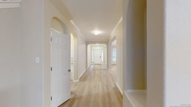 a view of a room with wooden floor