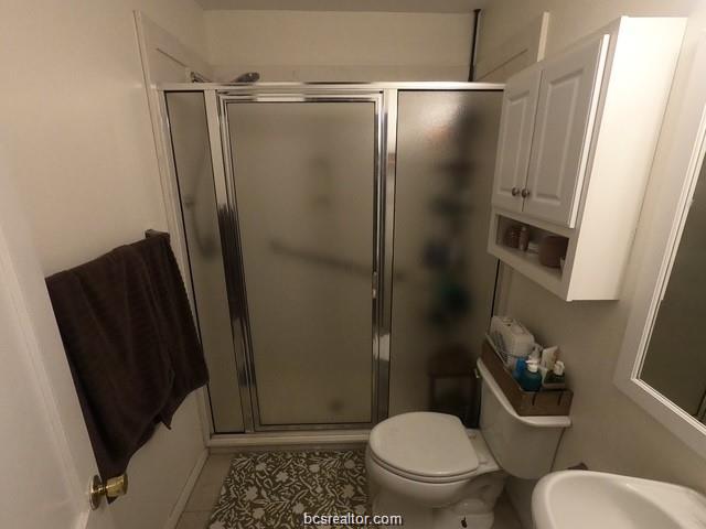 4200 Culpepper Drive Bryan, TX 77801 - Photo 8 of 18 a bathroom with a toilet and a shower