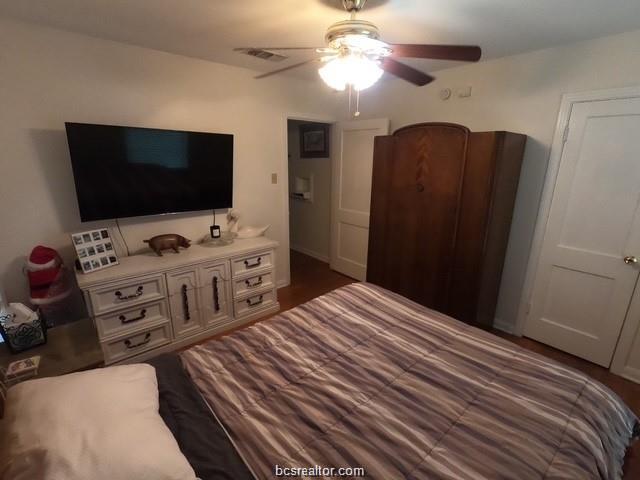 4200 Culpepper Drive Bryan, TX 77801 - Photo 10 of 18 a bedroom with a bed and a flat screen tv