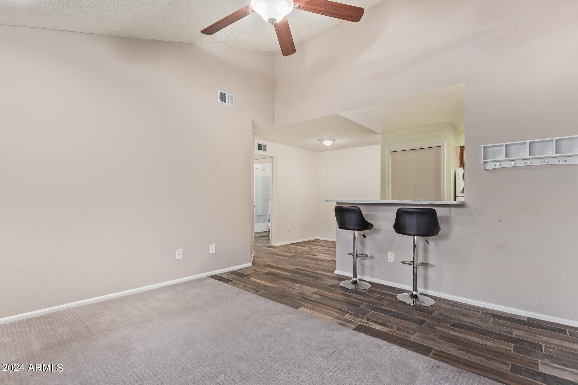 533 West Guadalupe Road, Unit 2046 Mesa, AZ 85210 - Photo 6 of 29 a room with furniture and a chandelier fan