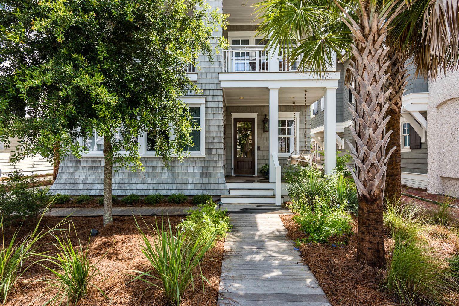 109 Compass Point Way Watersound, FL 32461 - Photo 1 of 2 a view of a house with plants and large trees