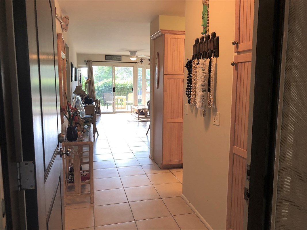 68-1745 Waikoloa Road, Unit J101 Waikoloa, HI 96738 - Photo 3 of 5 a hallway with a view of living room