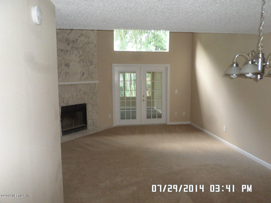 11757 Wattle Tree Road West Jacksonville, FL 32246 - Photo 3 of 5 a view of an empty room with a window
