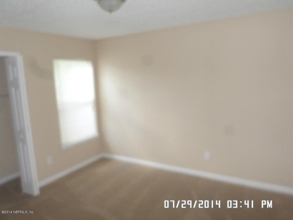 11757 Wattle Tree Road West Jacksonville, FL 32246 - Photo 5 of 5 a view of an empty room and window