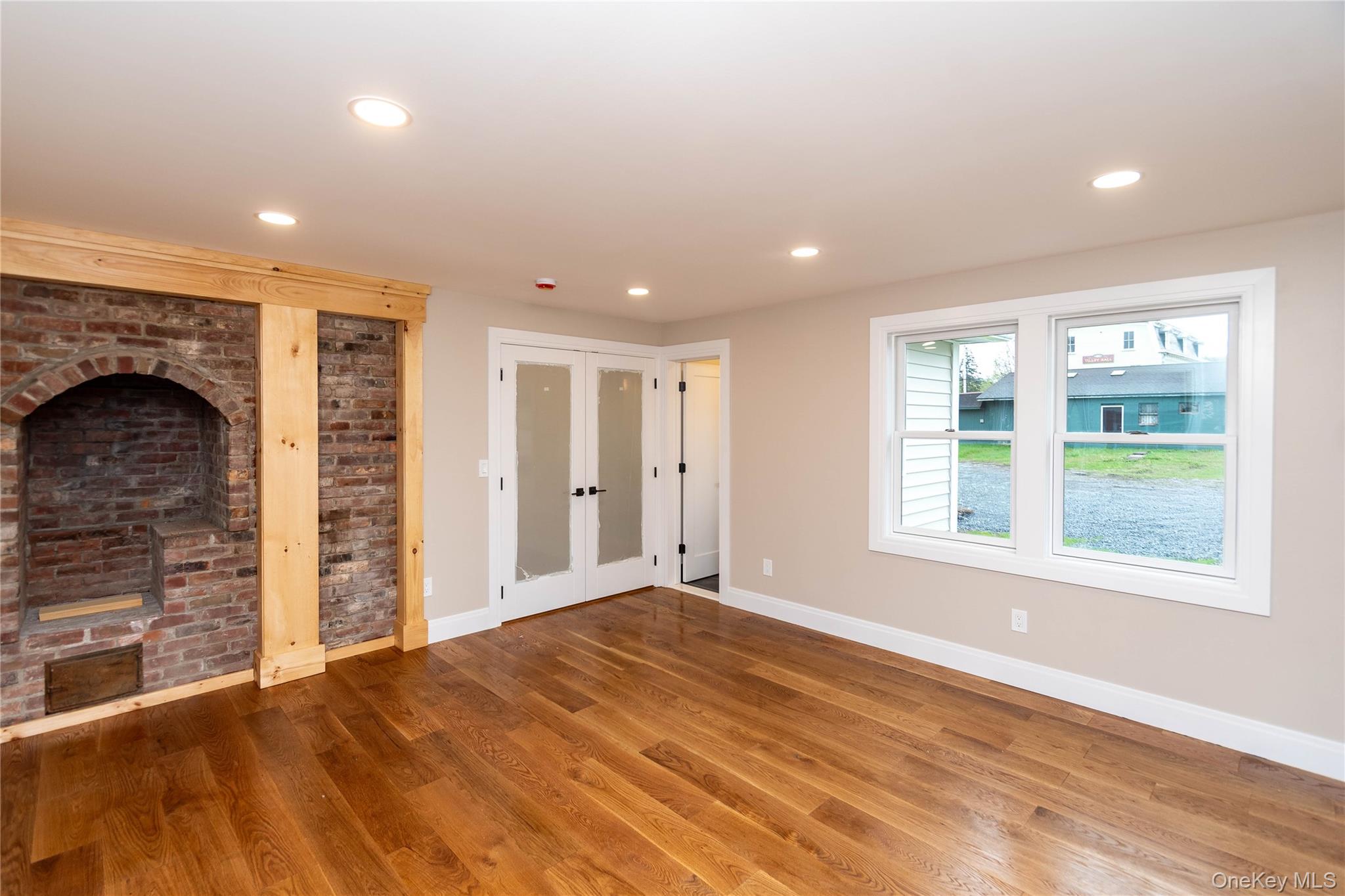 4407 Albany Post Road Hyde Park, NY 12538 - Photo 21 of 44 a view of an empty room with a fireplace and a window