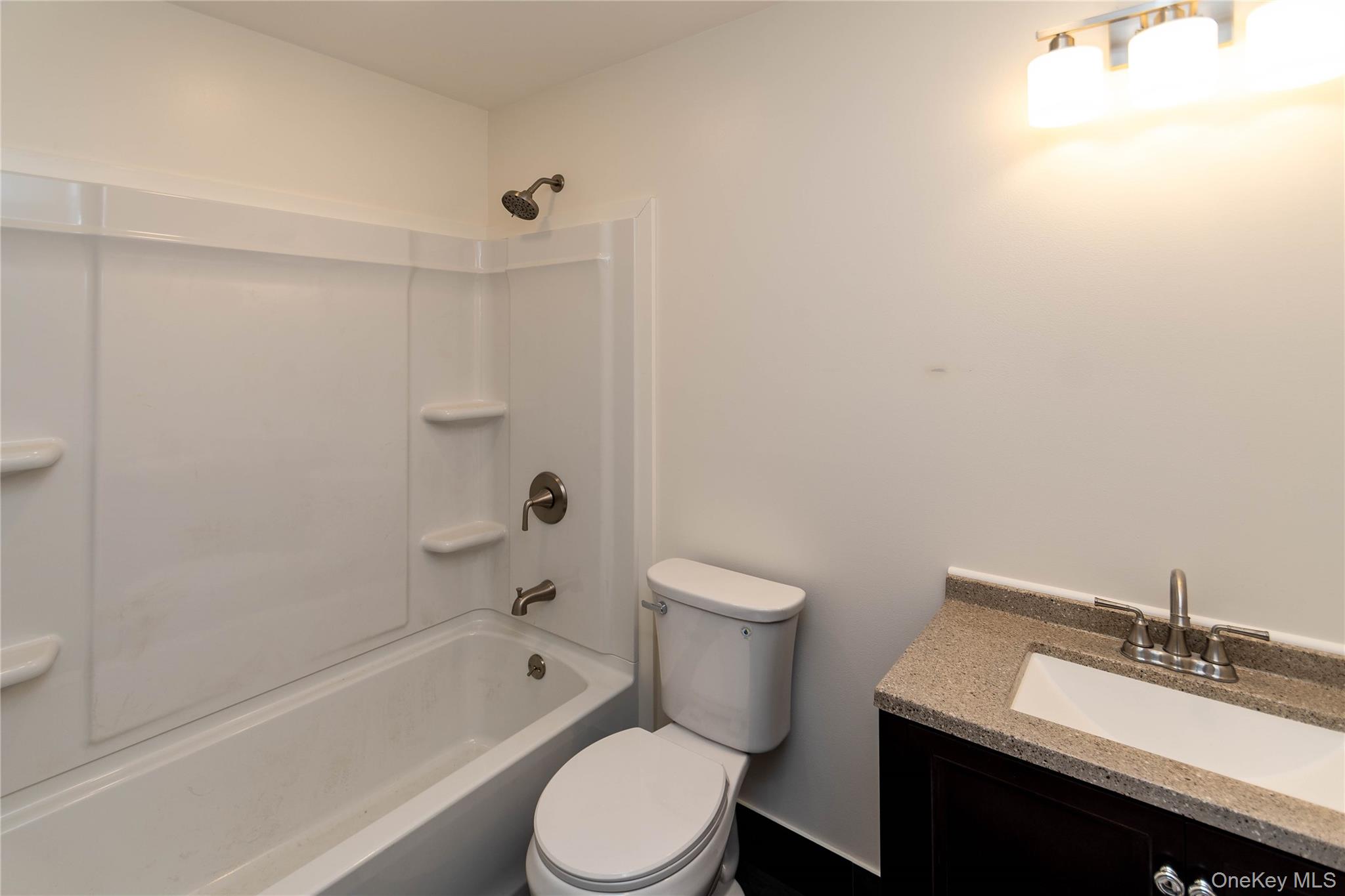 4407 Albany Post Road Hyde Park, NY 12538 - Photo 39 of 44 a bathroom with a sink a toilet and bathtub