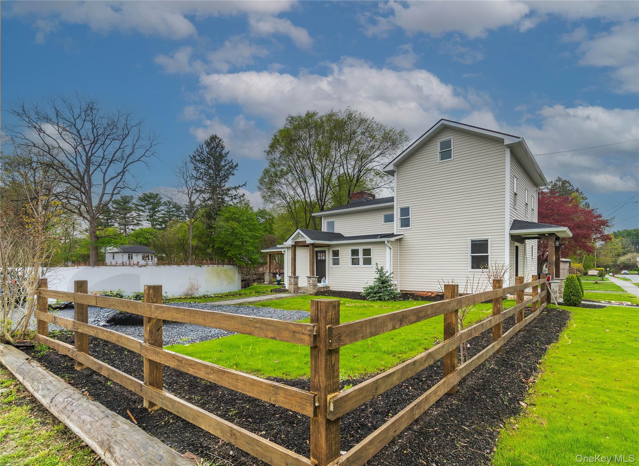 4407 Albany Post Road Hyde Park, NY 12538 - Photo 5 of 44 a front view of a house with garden