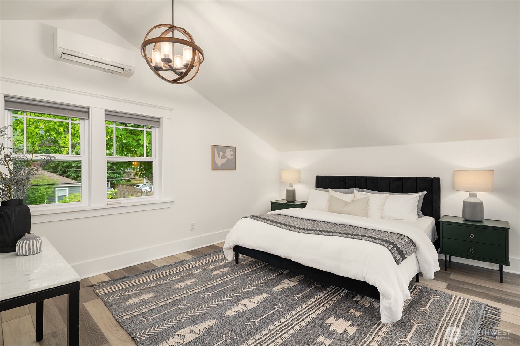 519 27th Avenue Seattle, WA 98122 - Photo 16 of 38 a spacious bedroom with a bed and a window