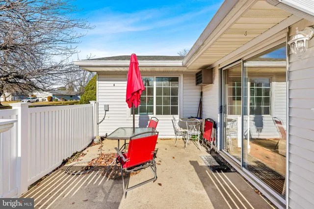 a view of living room with a large window and furniture