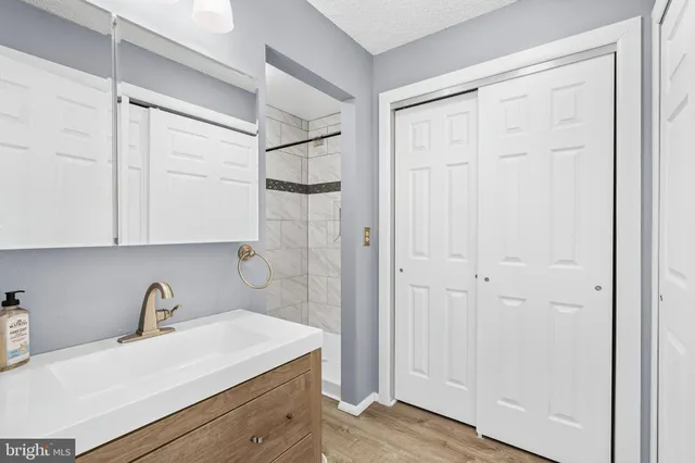 a view of a kitchen with white cabinets