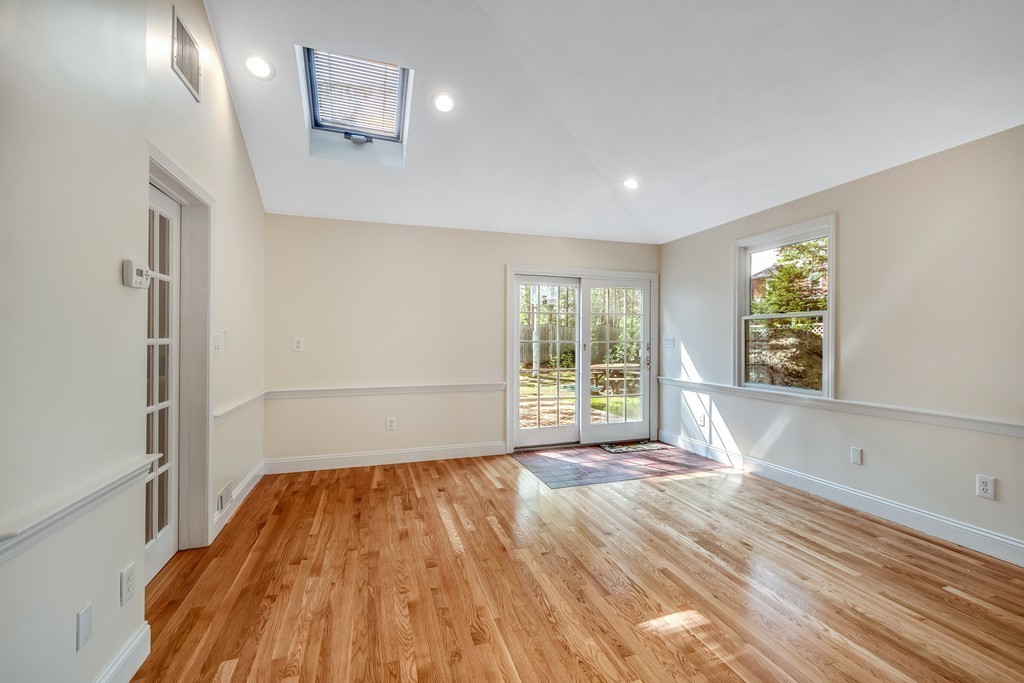 43 Kendall Road Newton, MA 02459 - Photo 11 of 22 a view of wooden floor in an empty room with a window