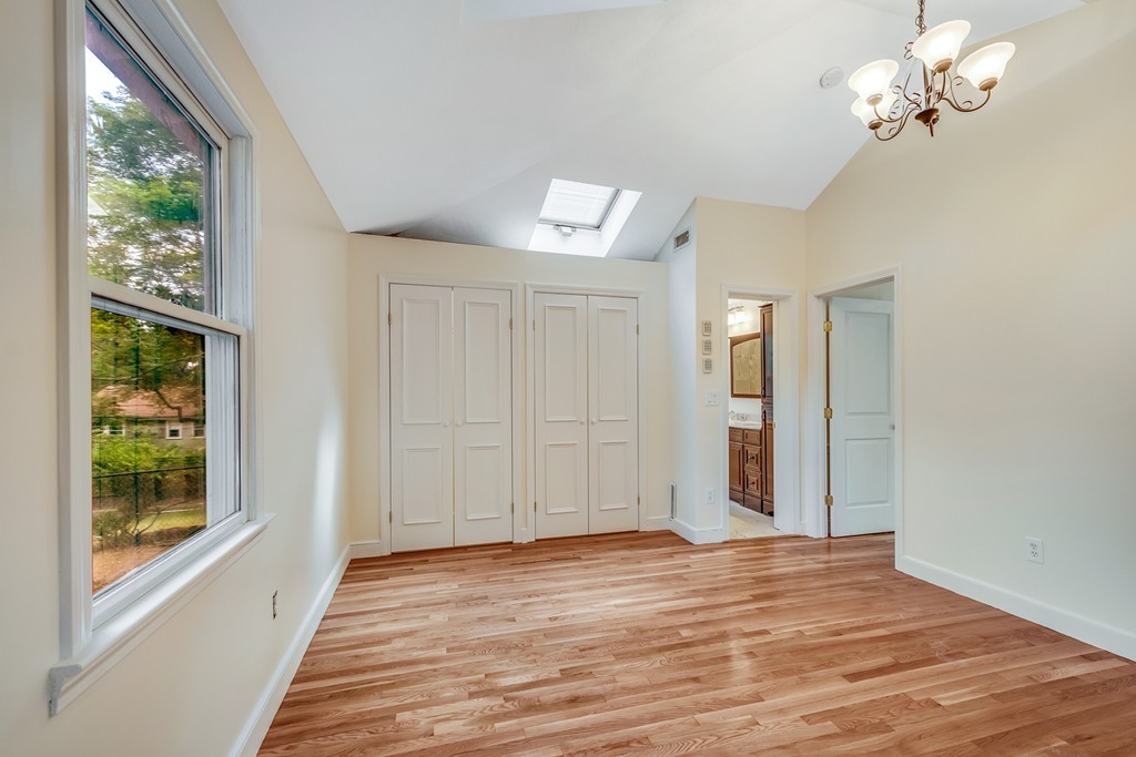 43 Kendall Road Newton, MA 02459 - Photo 14 of 22 a view of an empty room with wooden floor and a window