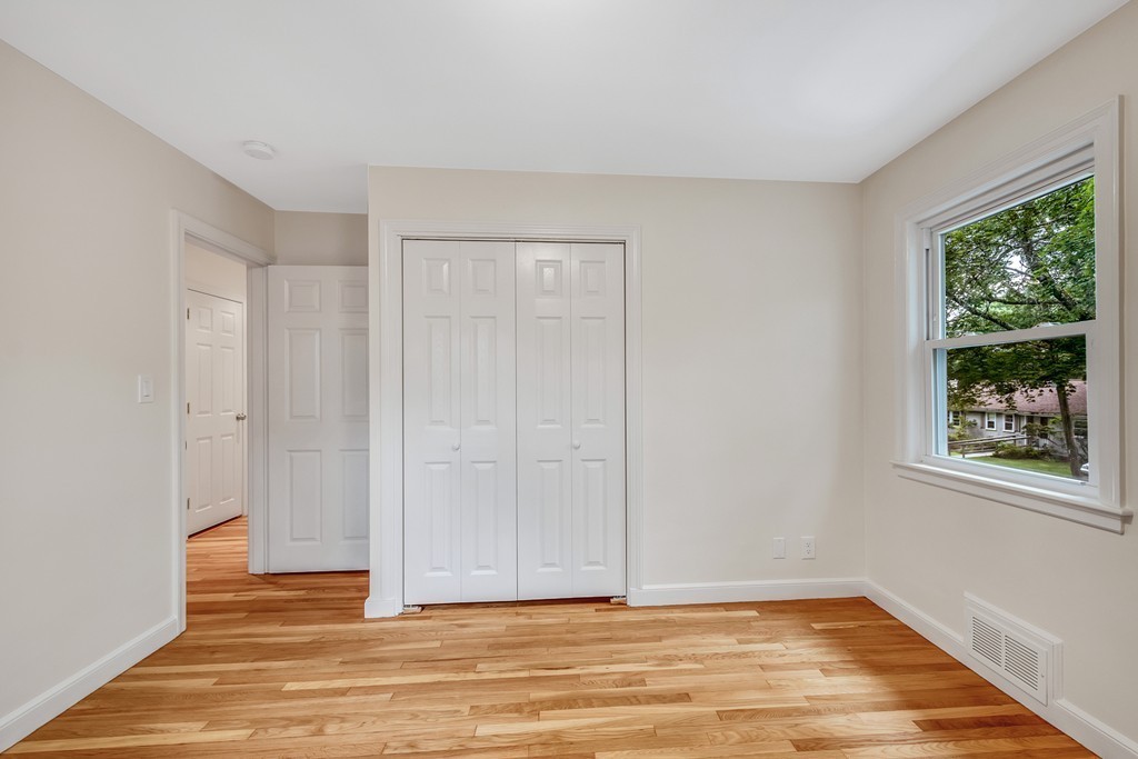 43 Kendall Road Newton, MA 02459 - Photo 17 of 22 a view of an empty room with wooden floor and a window