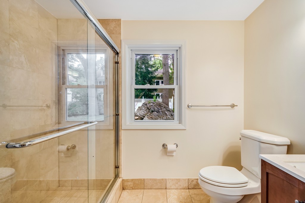 43 Kendall Road Newton, MA 02459 - Photo 19 of 22 a white toilet sitting next to a bathroom sink