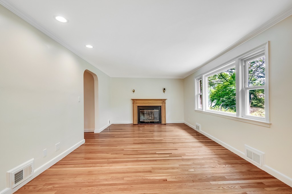 43 Kendall Road Newton, MA 02459 - Photo 4 of 22 a view of an empty room with wooden floor and a window